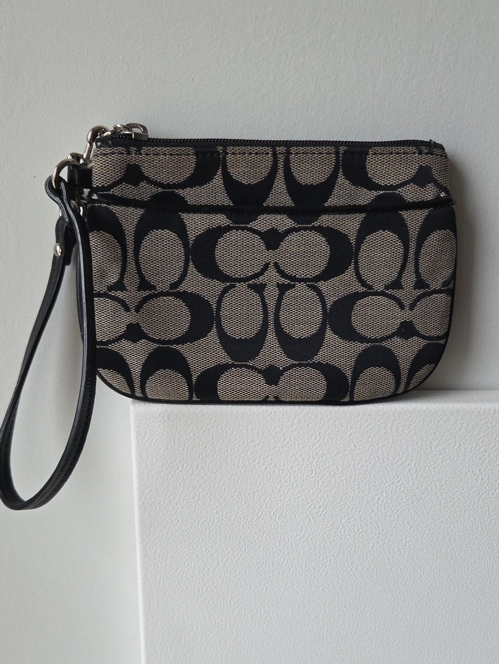 Coach Black Signature Canvas Wristlet with Tan Background